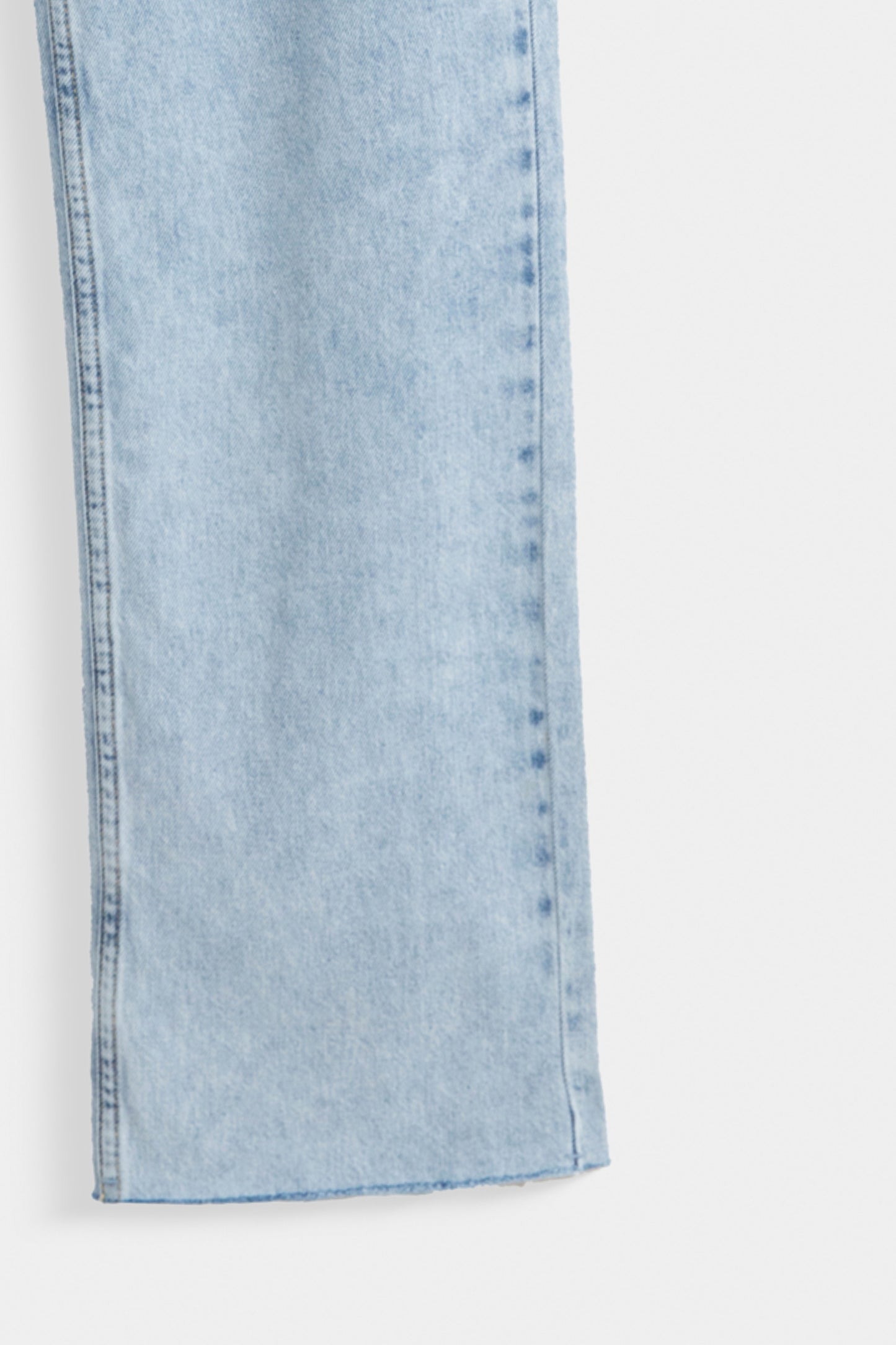 Straight Fit Jeans With Distressed Hem